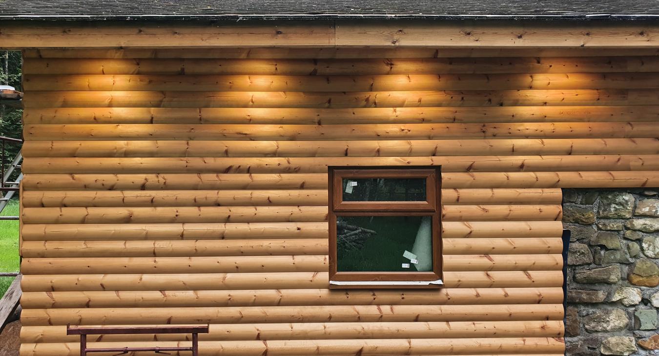 Outdoor lighting installation on wooden cabin in Telford